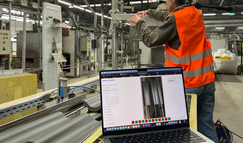 Worker monitoring Enao Vision dashboard on production floor